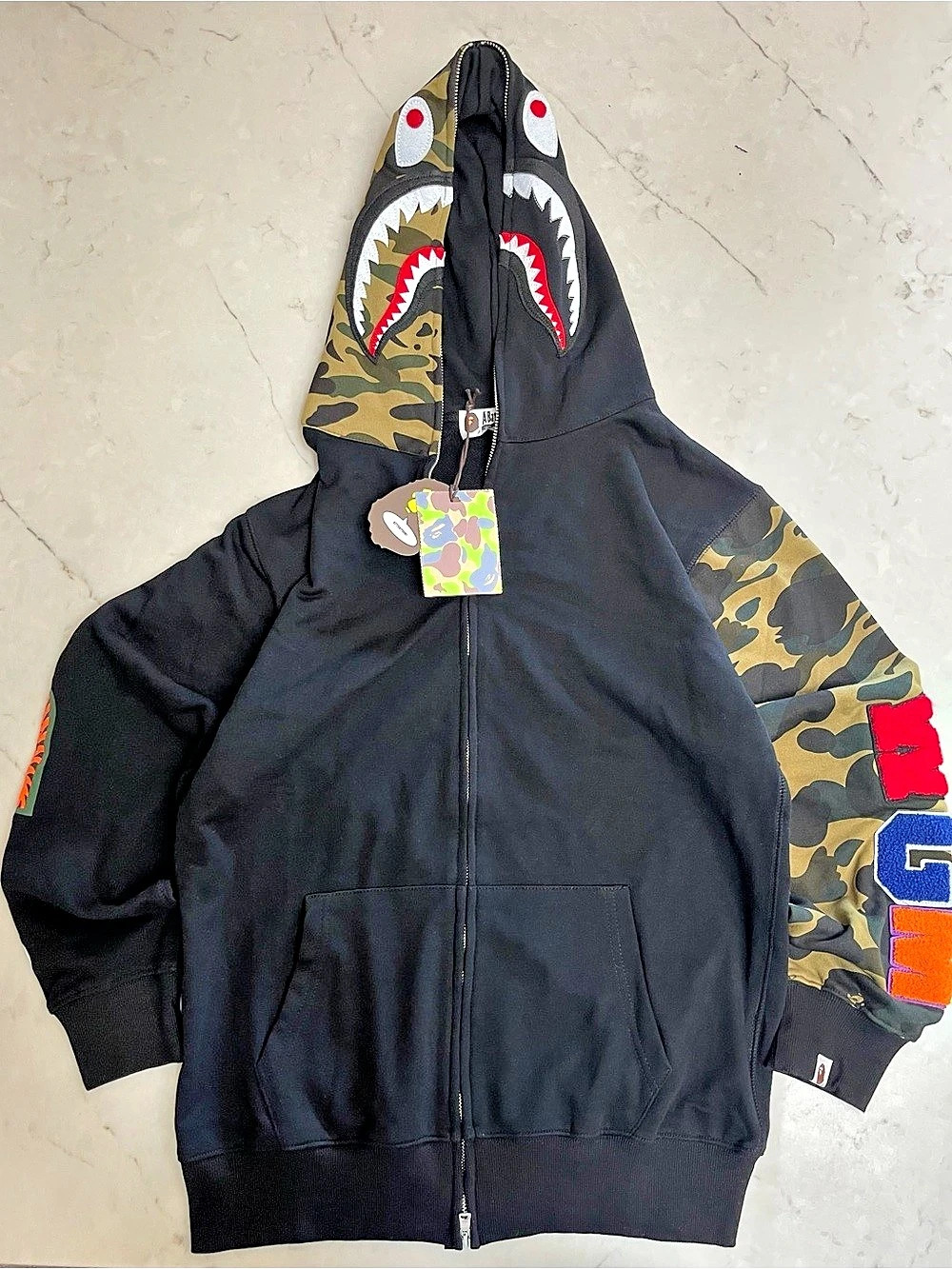 BAPE Shark full-zip hoodie in black with green camo sleeves